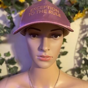 stylish pink/purple and gold hat made for casual wear or outdoor wear